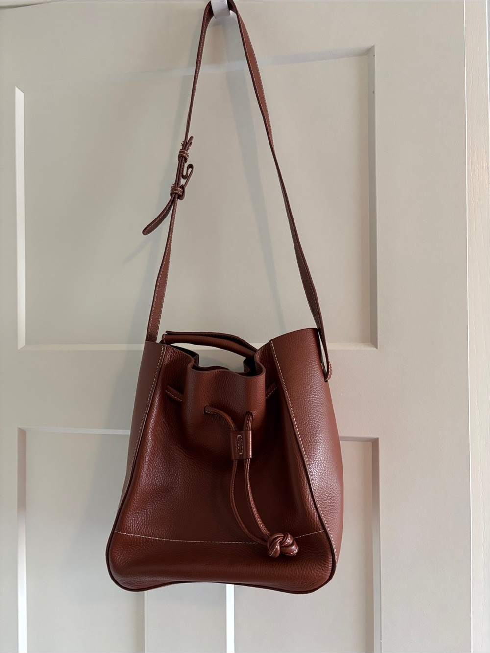 Flattered leather bucket bag